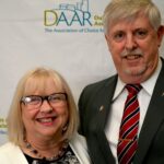 Dulles Area Association of Realtors members in formal attire standing for an award ceremony