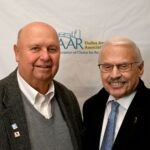 Dulles Area Association of Realtors members smiling for an award