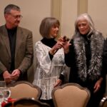 Dulles Area Association realtors passing down the award gavel to each member