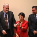 Dulles Area Association realtors taking turns with the award gavel