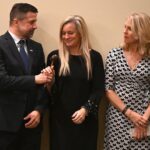 Dulles Area Association realtors passing down the award gavel between members