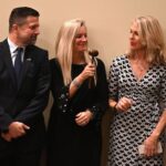 Dulles Area Association realtors passing down the award gavel between all of its members