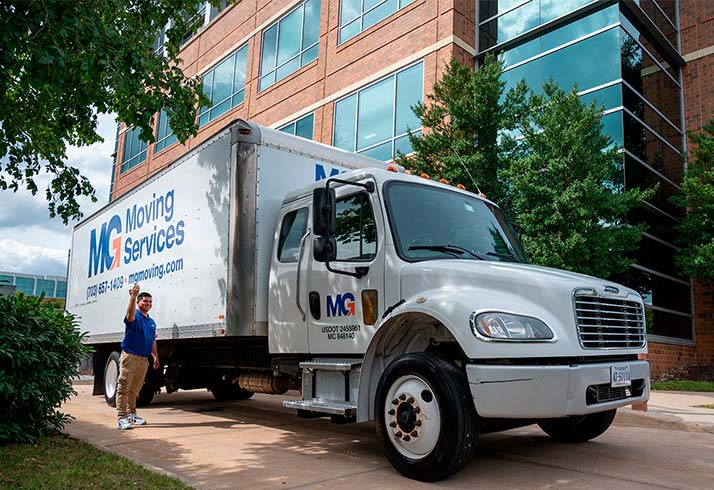MG Moving Services truck and employee