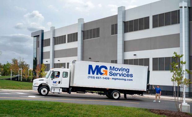 MG Moving Services truck outside of a building in Northern Virginia
