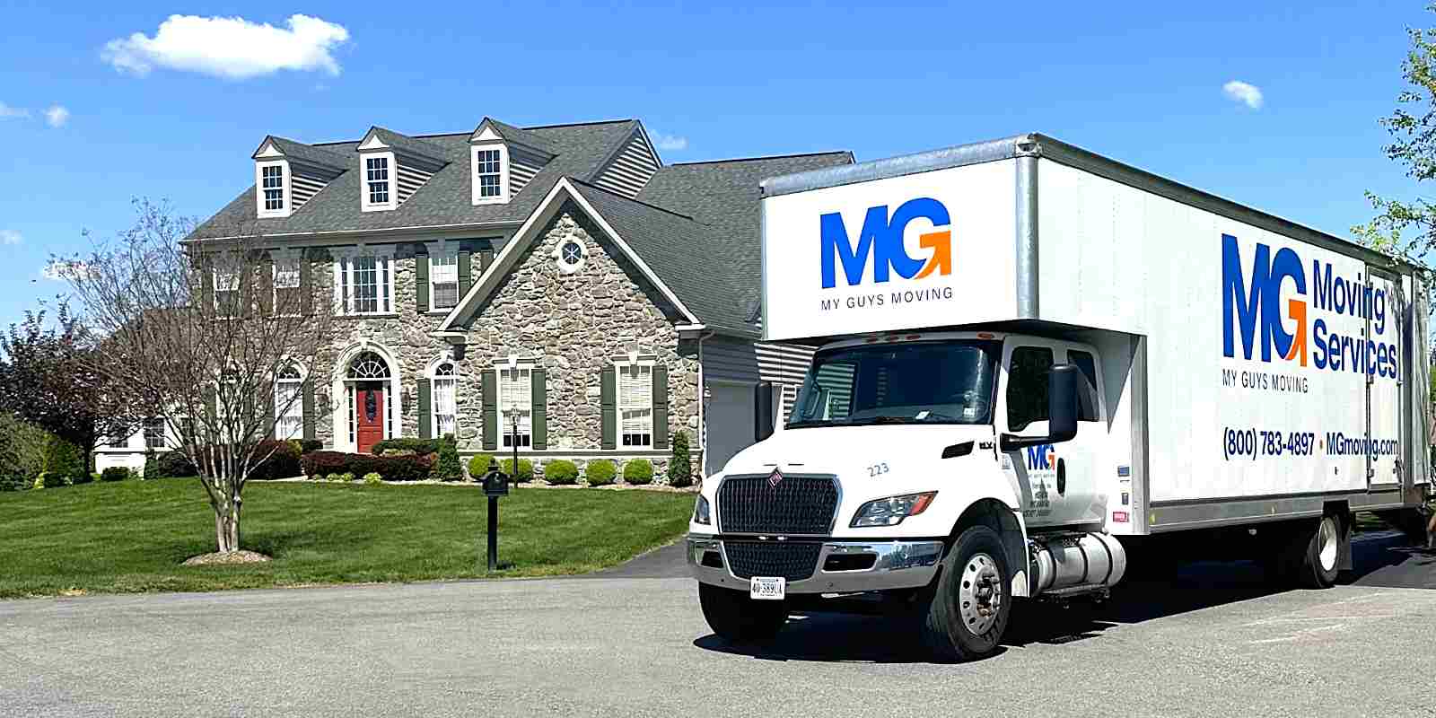 residential home with MG Moving truck