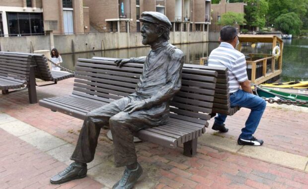 state of robert simon sitting on a bench in reston virginia