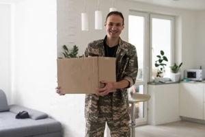 soldier holding shipping box