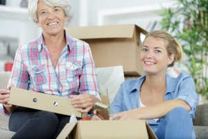senior woman and adult woman together at home