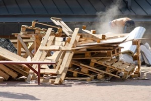 tree dump building, builder in the background